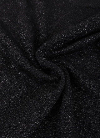 Black wool-blend knit fabric close-up, drape texture with soft sheen