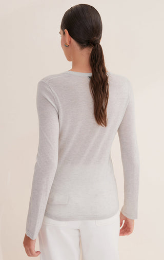 Rear view of light heather sheer scoop-neck long-sleeve top, clean straight hem.