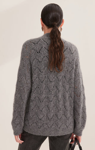 Gray-blue openwork knit sweater back with diamond pattern and tiny sequins