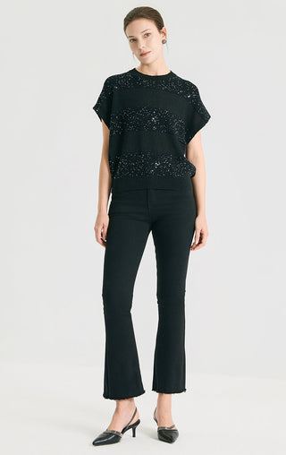 Black sequin short-sleeve knit sweater worn with dark pants, easy fit