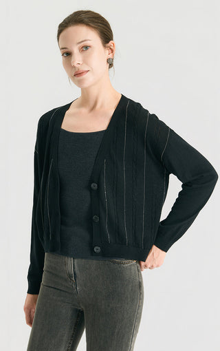 Black v-neck button cardigan with cable-knit panels and contrast stitched lines