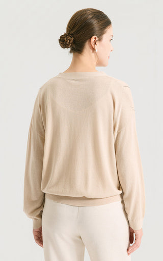 Camel knit cardigan back view with full-length sleeves and smooth solid knit