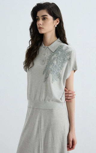 Gray polo knit top with sequin chest panel and collar with button placket