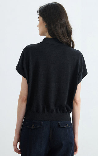 Black polo knit top back view, short sleeves and ribbed hem at waist
