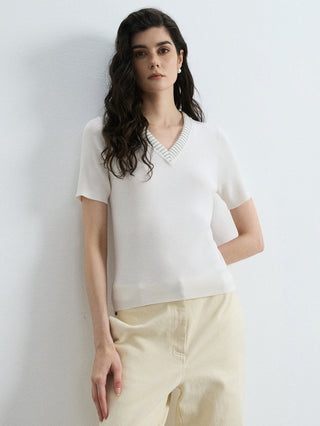 Ivory knit ribbed V-neck top, slim-fit, short sleeves—front view