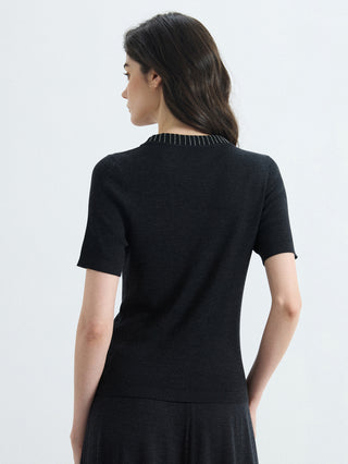 Black ribbed knit top from back view with V-neck collar and short sleeves