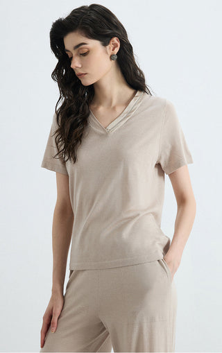 Beige v-neck knit tee with short sleeves, side profile view