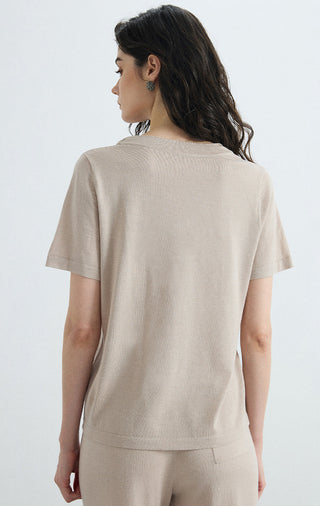 Beige knit tee back view, short sleeves and rounded hem