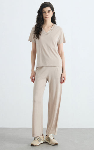 Beige v-neck knit tee with short sleeves, relaxed drape