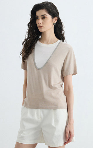 Beige layered knit tee, side profile, contrast V-neck trim and white inner neck