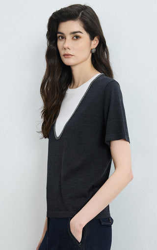 Black layered knit tee side profile, contrast V-neck trim and short sleeves