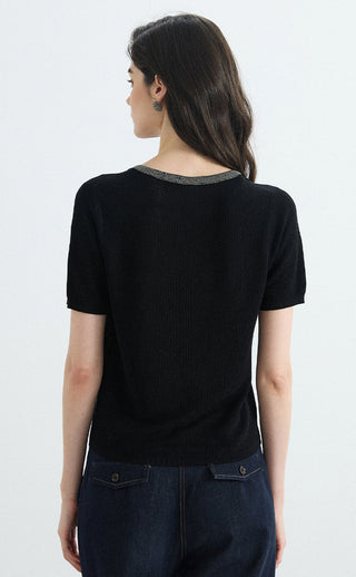Back view of black knit top with silver-trim crew neckline
