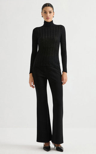 Black ribbed turtleneck knit top with high neck and long sleeves