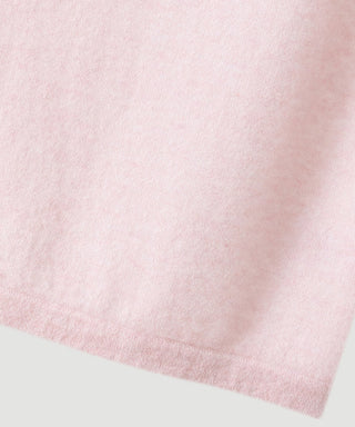 Light pink cashmere knit fabric close-up at the hem