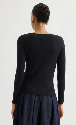 Black fine-rib long-sleeve knit top, back view with smooth fitted shape