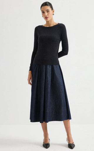 Black fine-rib long-sleeve knit top with crew neck, styled with denim skirt