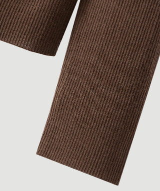 Fine-rib wool knit fabric close-up on brown long-sleeve cuff, ribbed texture