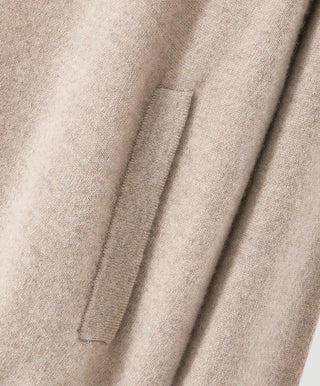 Camel cashmere zip-front knit jacket, visible front zipper and placket.