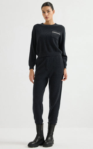 Black wool ribbed pocket sweater with crew neck, ribbed cuffs, and striped chest pocket