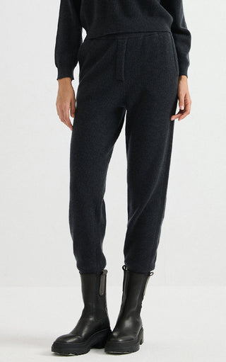 Dark wool ribbed knit jogger pants with elastic ankle cuffs and relaxed legs