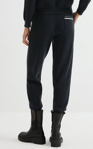 Dark wool ribbed knit jogger pants with cuffed hem and side seam details