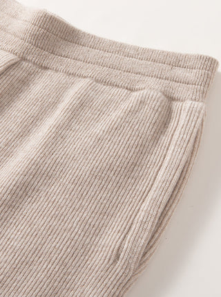 Ivory wool ribbed knit jogger pants with elastic waistband and ribbed leg texture