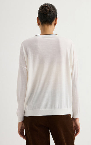 White wool fine-knit V-neck sweater shown from back with ribbed cuffs
