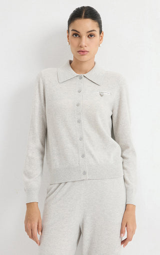 Light grey cashmere collared cardigan with button front, long sleeves, and chest pocket