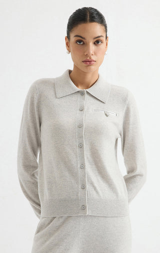 Light grey cashmere cardigan with pointed collar, button front, and chest logo tab