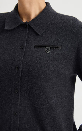 Graphite grey collared cardigan close-up with button placket and rectangular chest logo