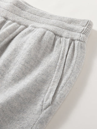 Light grey cashmere wide-leg knit pants with ribbed elastic waistband and pleated front