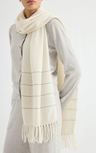 Ivory cashmere wrap with openwork stripe bands and short fringe, worn around the neck