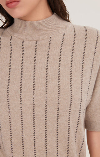 Close-up of camel cashmere mock neck top with vertical sequin stripe knit pattern