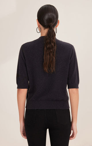 Back view of black cashmere mock neck top with sequin stripe detail
