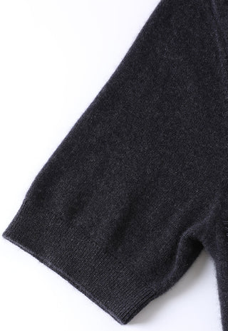 Black cashmere top sleeve and hem close-up