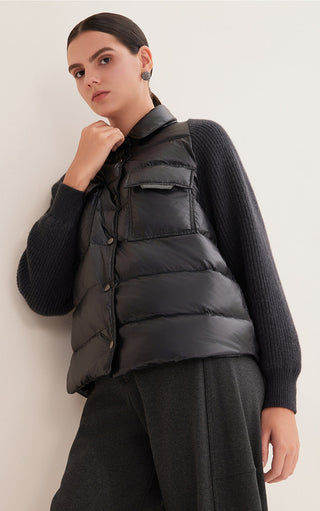 Black quilted down shirt jacket, button front and patch pockets over knit sleeves