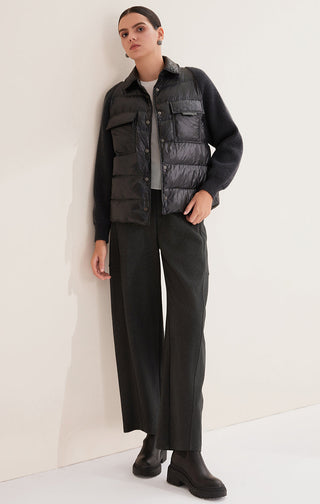 Black women’s down shirt jacket with quilted front, snap buttons, and two chest patch pockets