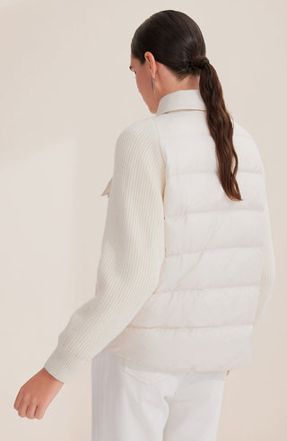 White women’s down shirt jacket from back view with horizontal quilting and high collar