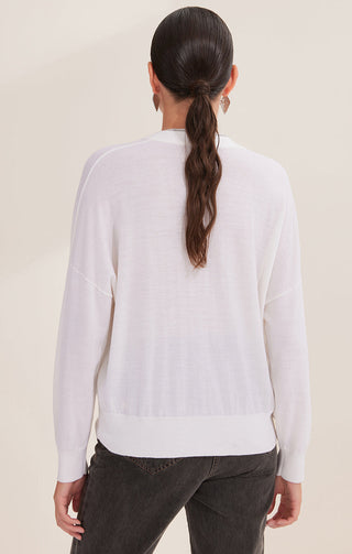 Back view of off-white wool V-neck button pullover with long sleeves and ribbed hem
