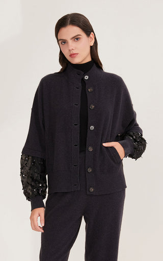 Black cashmere cardigan with decorative front seam and embellished cuff sleeves.
