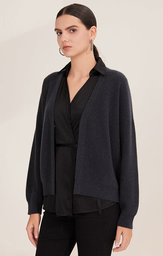 Black wool cardigan with deep V neck and open button front over silk vest