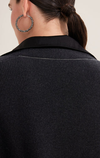Black wool cardigan back with textured knit and stitched yoke seam