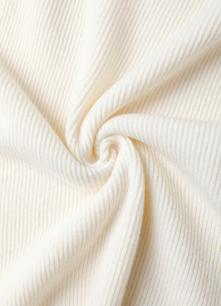 Close-up of ivory ribbed knit fabric texture