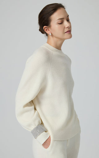 Ivory knit sweater, back view, with contrast cuff bands and ribbed collar