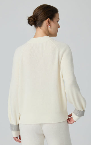 Ivory wool ribbed knit sweater from back with contrast cuff bands on sleeves