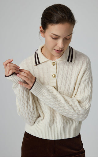 Cream cable-knit wool polo sweater with striped collar and gold buttons, long sleeves