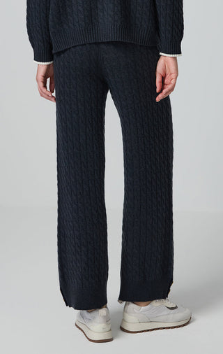 Graphite gray wool cable-knit pants with relaxed wide legs and ribbed hem cuffs.