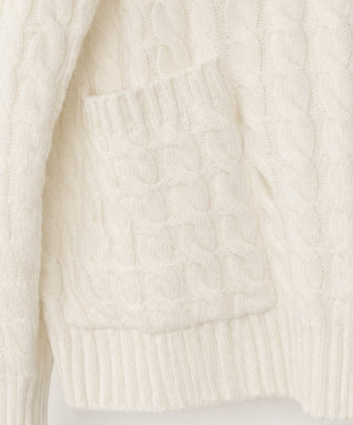 Ivory cable-knit cardigan hem with ribbed cuff bands