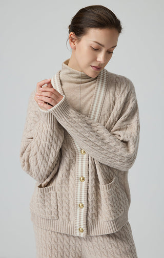 Camel cable knit wool cardigan with contrast trim, patch pockets, and gold buttons