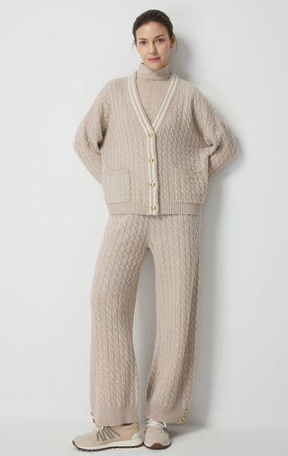 Camel wool cable knit cardigan with contrast trim, patch pockets, and gold buttons